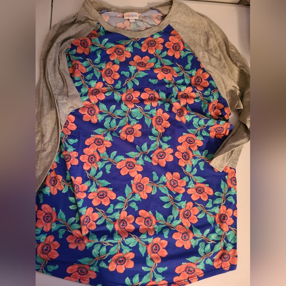 3 Lularoe Shirts. 2 Randy shirts and 1 Irma Shirt 3XL